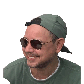 Picture of Tom Phillips smiling.