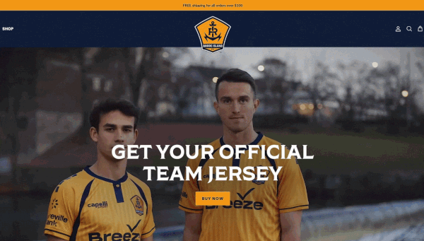Video of two Rhode Island FC soccer players displaying their yellow team jersey.